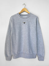 Embroidered bumble bee design on grey sweatshirt, hanger shot with plain background.